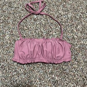 Blush colored strapless bathing suit top that comes with an attachable strap.